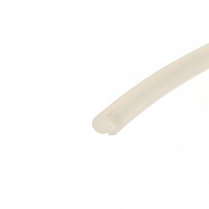 Close-up of a beige cylindrical object with a rounded end, diagonally placed across a white background.