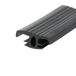 Close-up of a black rubber extrusion with a ribbed top surface and a hollow, channelled cross-section