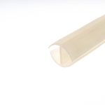 Close-up of a beige masking tape roll diagonally across a white background, showing curved edge and layers