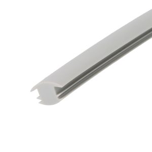 Close-up of a light gray plastic trim with a serrated edge, angled across the frame.