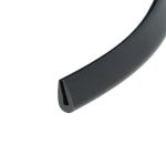 Close-up of a black curved object with a notch at its end on a white background, likely a plastic or metal tool part.