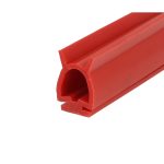 Close-up of a red LEGO Technic beam with a round through-hole and beveled edges.