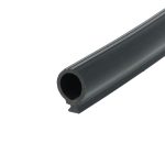 Close-up of a black metal cylindrical tube with a hollow circular opening, angled across the frame.