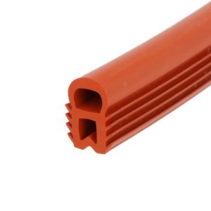 Close-up of orange hollow plastic tubing with rounded ends and ridged outer surface, diagonally oriented across the frame.