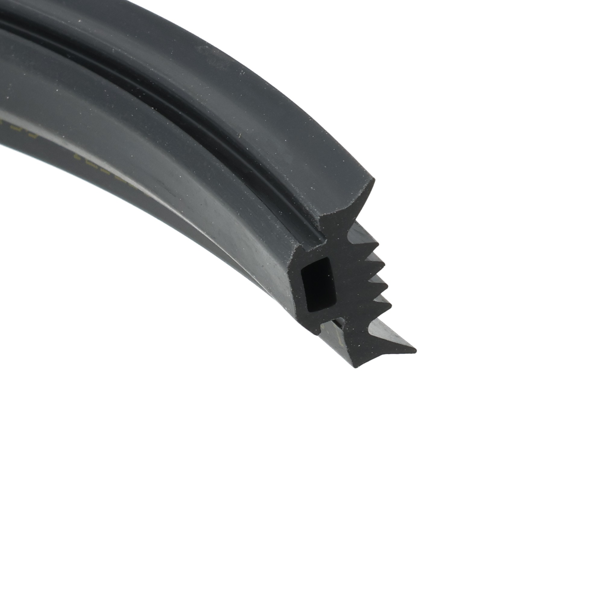 0221753_33 - Centrum uszczelek Close-up of a black curved plastic piece with a serrated gear-like edge, photographed against a white background.