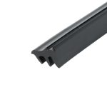 Close-up of a black metal tool edge with a grooved slot along the top, angled across a white background.