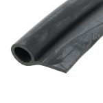 Close-up of a black foam pipe insulation tube with a hollow center and worn surface.