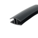 Close-up of a dark curved edge with a stepped inner profile, set against a white background.