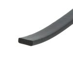 Close-up of a black foam weatherstrip or edging with porous inner core and smooth outer surface, diagonally oriented