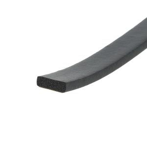 Close-up of a black foam weatherstrip or edging with porous inner core and smooth outer surface, diagonally oriented